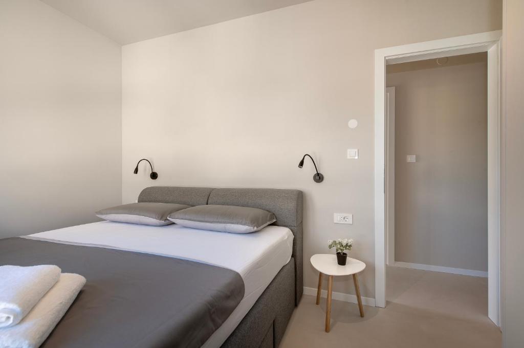 Posteľ alebo postele v izbe v ubytovaní Providenca Residence