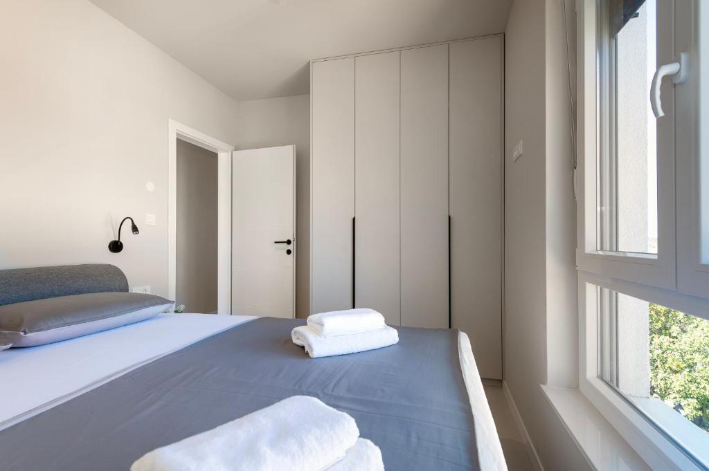 Posteľ alebo postele v izbe v ubytovaní Providenca Residence