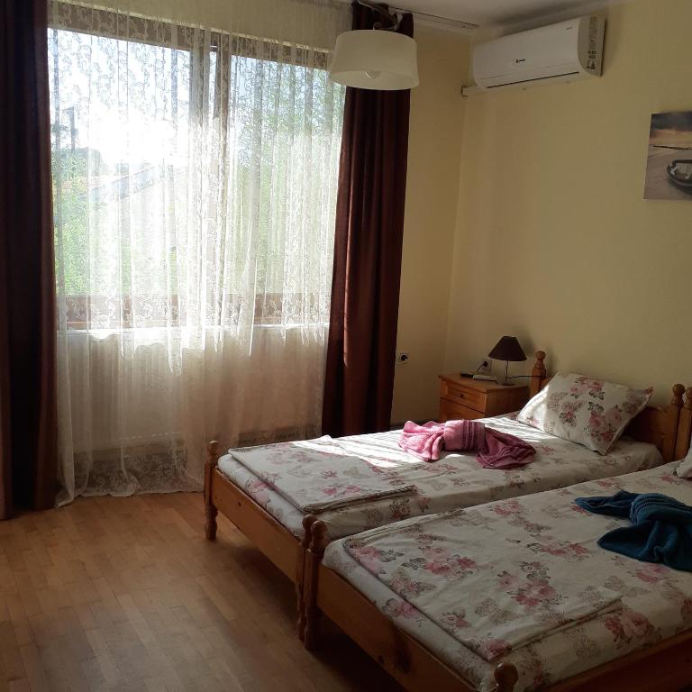 Postel nebo postele na pokoji v ubytování Guest House Sun