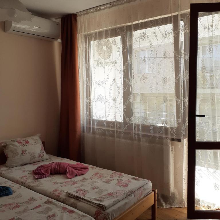 Postel nebo postele na pokoji v ubytování Guest House Sun