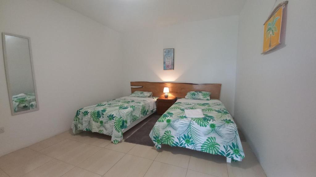 Postel nebo postele na pokoji v ubytování Kay Nou Apartments
