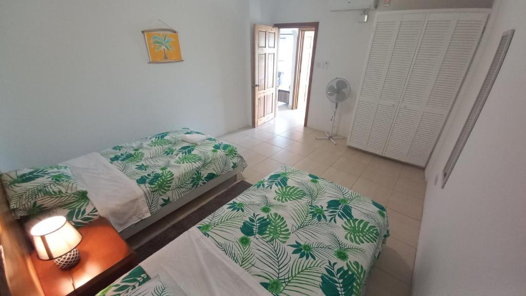 Postel nebo postele na pokoji v ubytování Kay Nou Apartments
