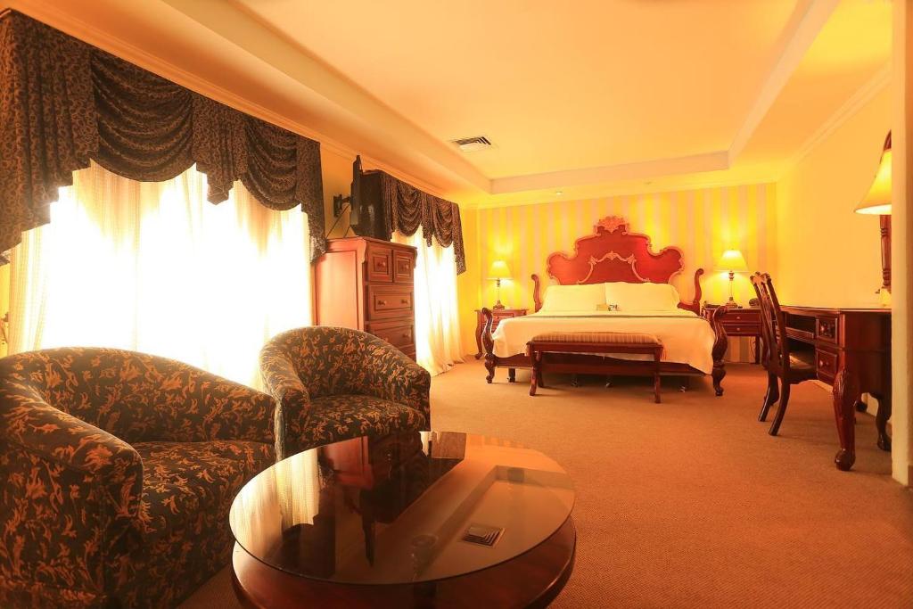 Postel nebo postele na pokoji v ubytování Boutique Hotel La Cordillera