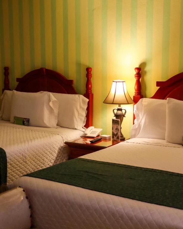 Postel nebo postele na pokoji v ubytování Boutique Hotel La Cordillera