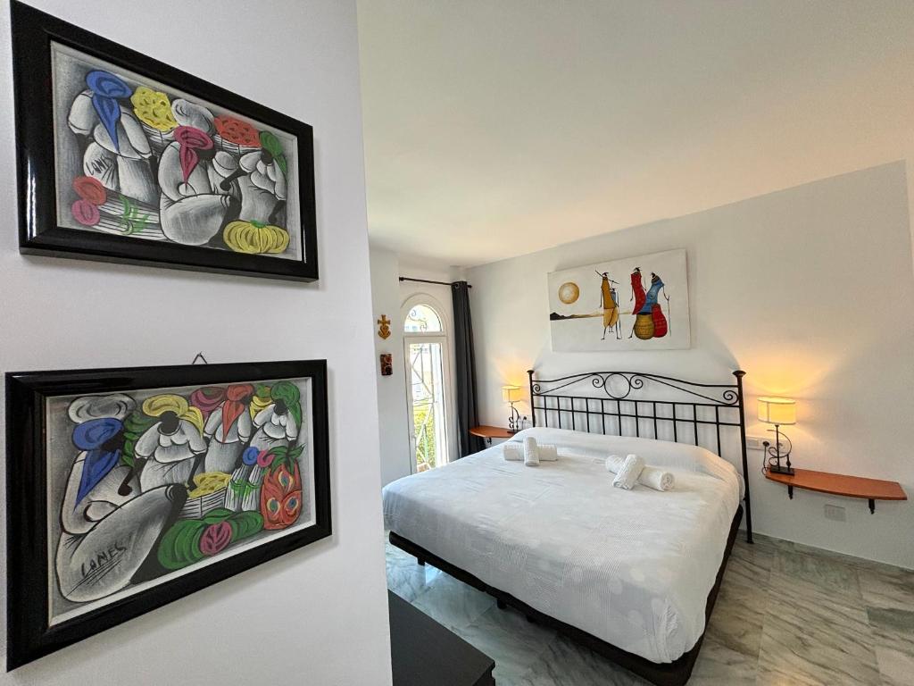 A bed or beds in a room at Diletta Beach Estepona