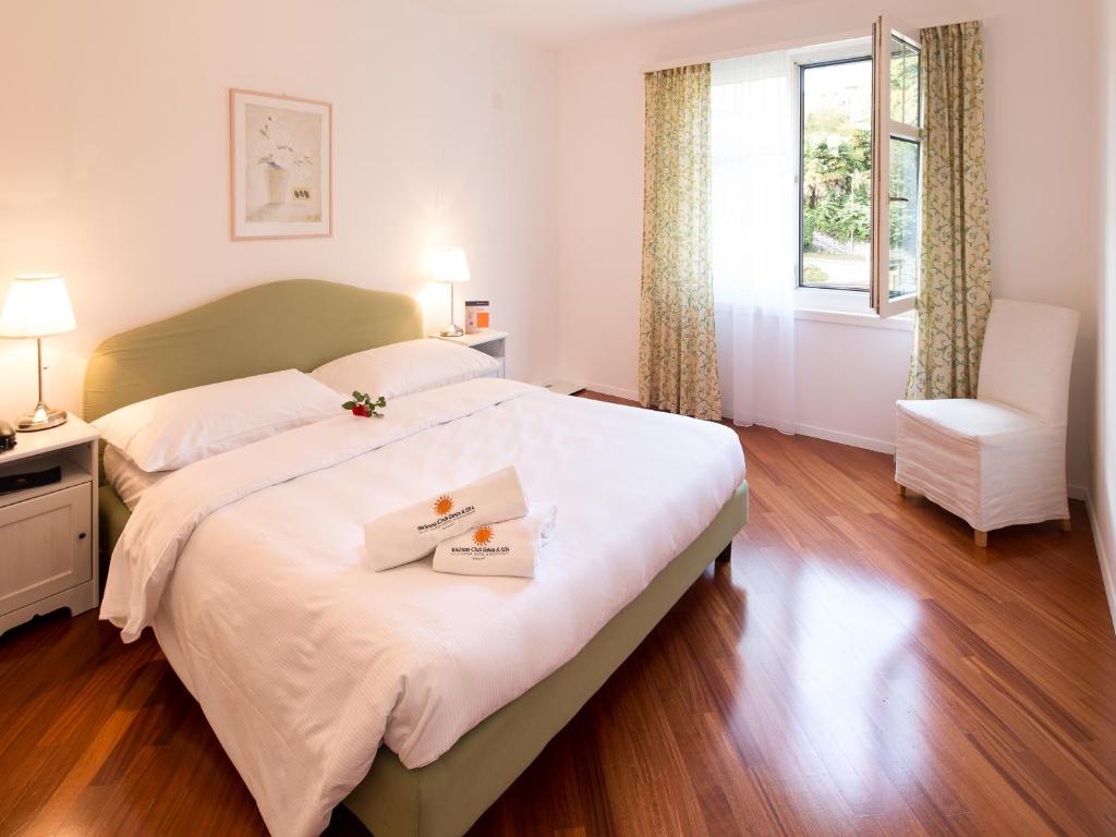 Postel nebo postele na pokoji v ubytování Villa Sassa