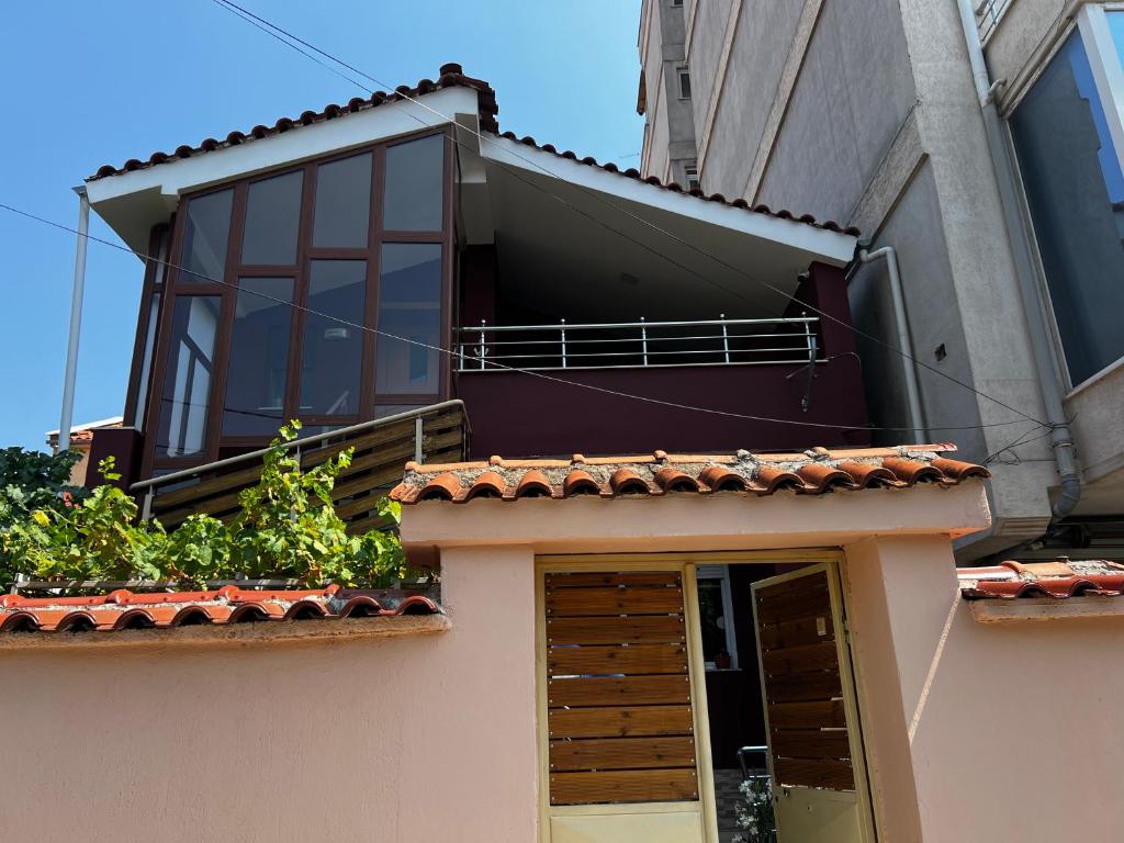a balcony on the side of a building at Retreat in the centre of Korce in Korçë