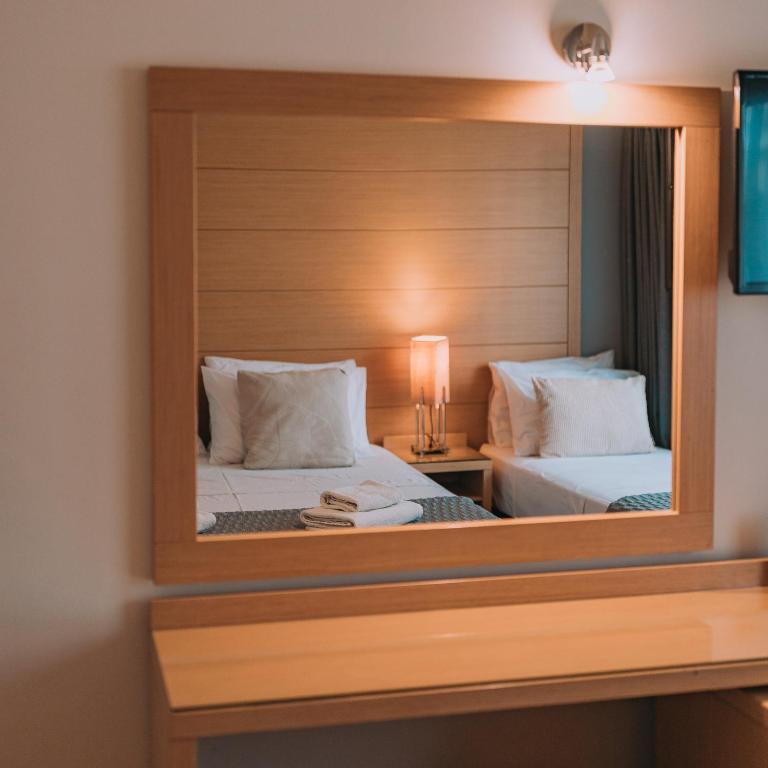 Posteľ alebo postele v izbe v ubytovaní Parnon Hotel