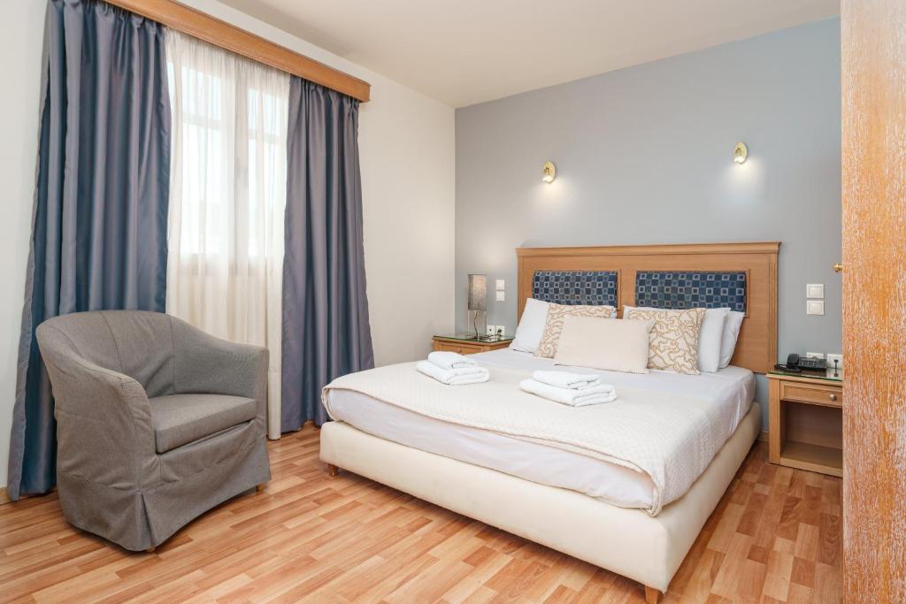 Posteľ alebo postele v izbe v ubytovaní Parnon Hotel