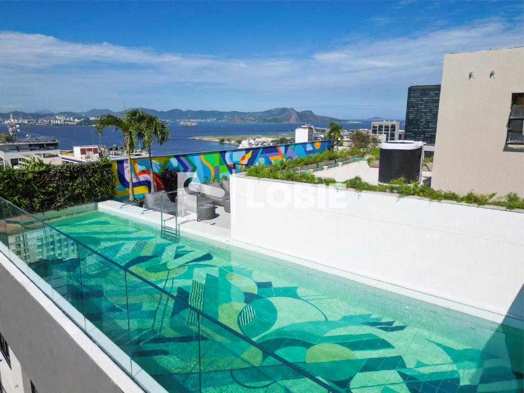a swimming pool on the roof of a building at Lobie Skylux in Rio de Janeiro