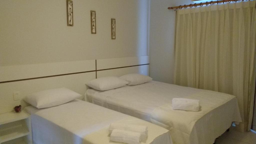 Postel nebo postele na pokoji v ubytování BoraBora Pousada