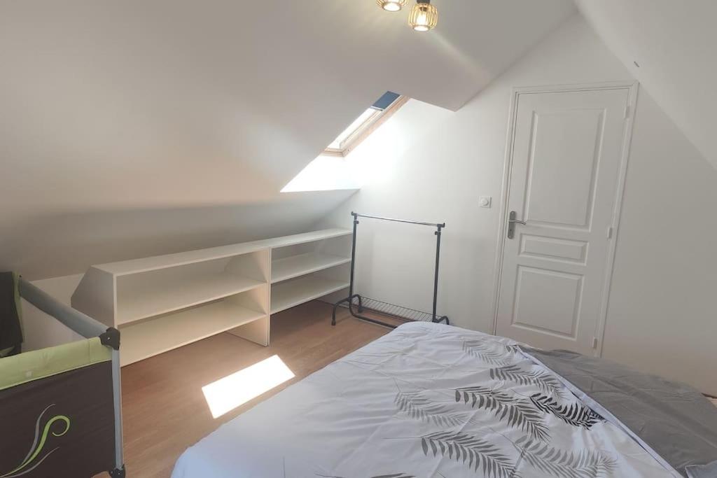 Postel nebo postele na pokoji v ubytování Gîte fleur du paradis