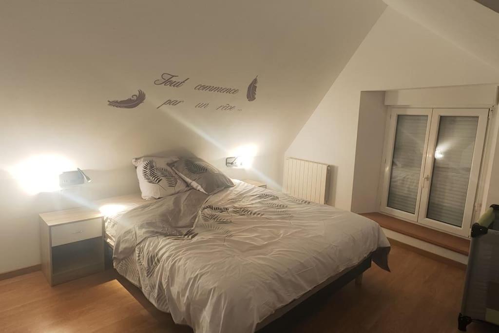 Postel nebo postele na pokoji v ubytování Gîte fleur du paradis