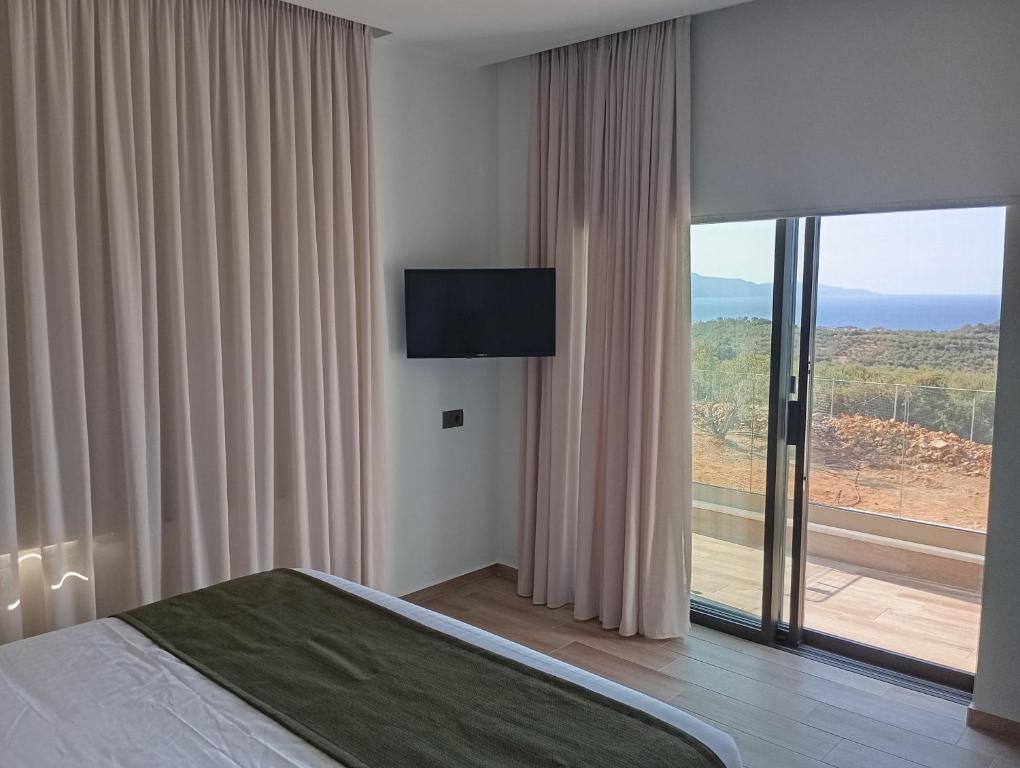 TV a/nebo společenská místnost v ubytování Afea Villas