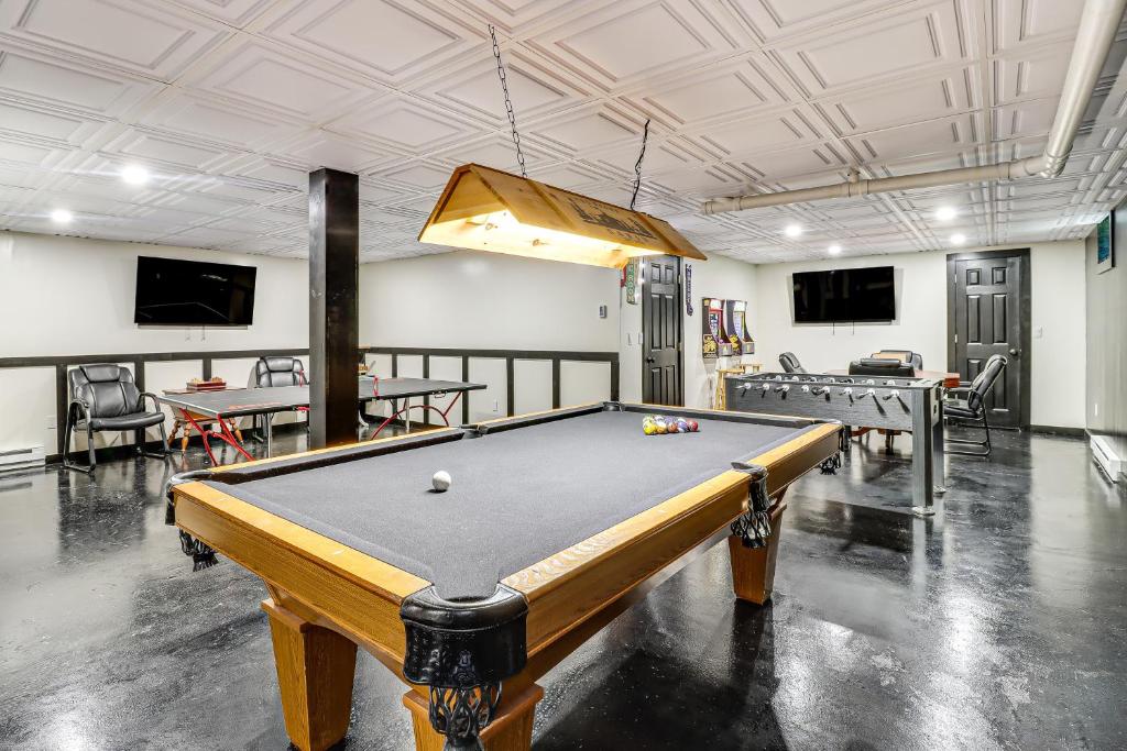 an empty room with a pool table in it at 7 Mi to Big Boulder Resort-Style Poconos Retreat in Albrightsville
