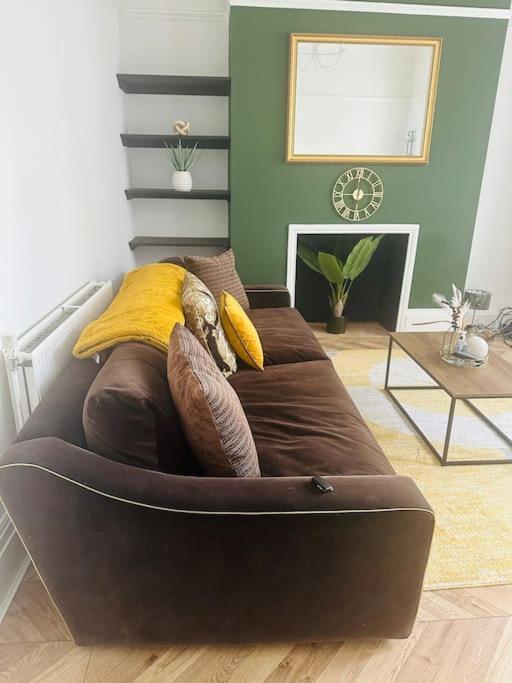 a bed with pillows on it in a room at Blessed Princess House With Free Parking in Sunderland