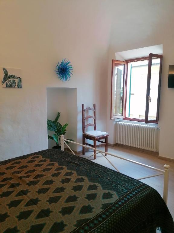 Postel nebo postele na pokoji v ubytování Camera Botanica