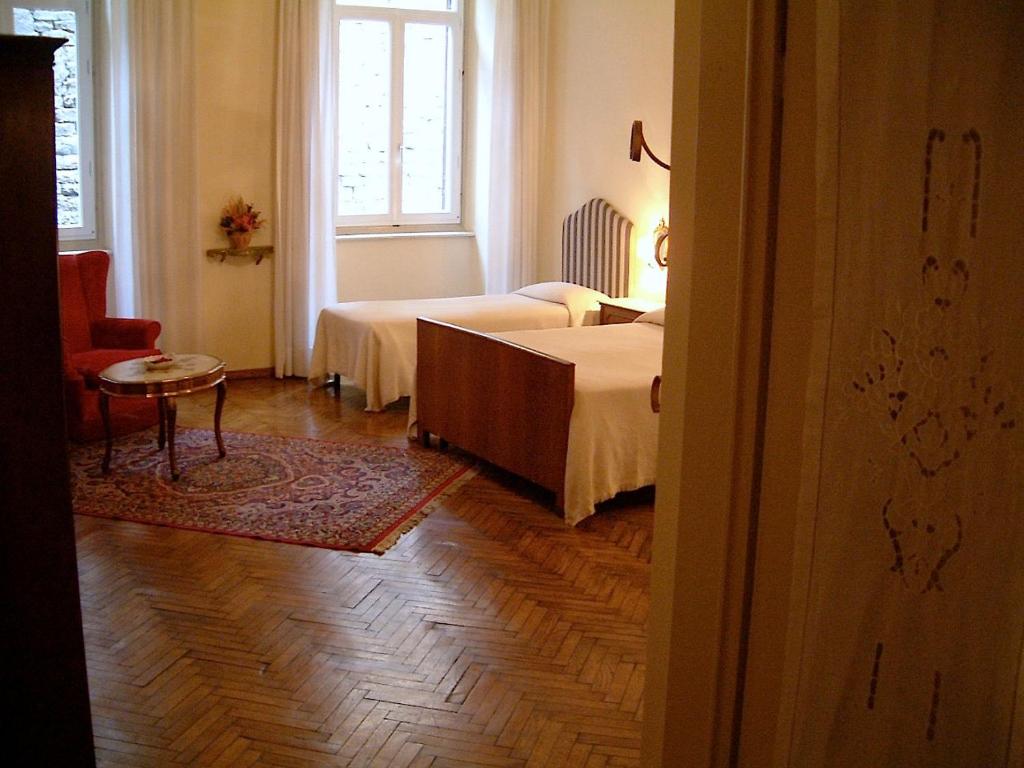 Postel nebo postele na pokoji v ubytování Hotel Cestelli