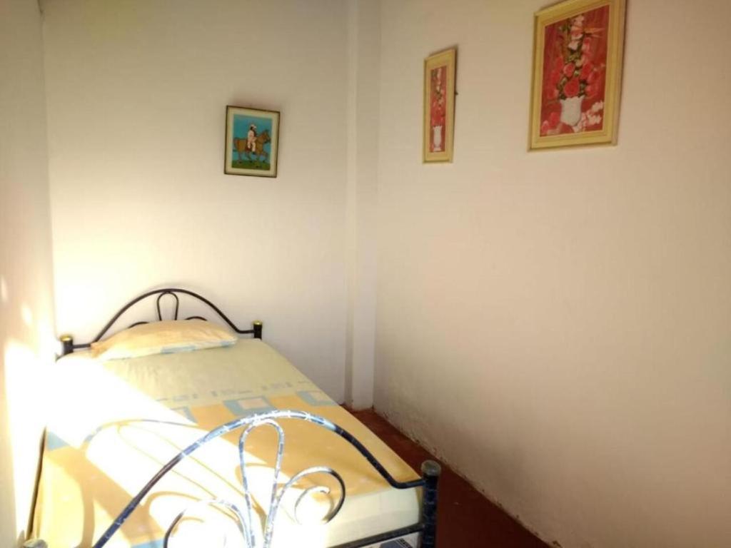 Postel nebo postele na pokoji v ubytování Hospedaje Costa Norte