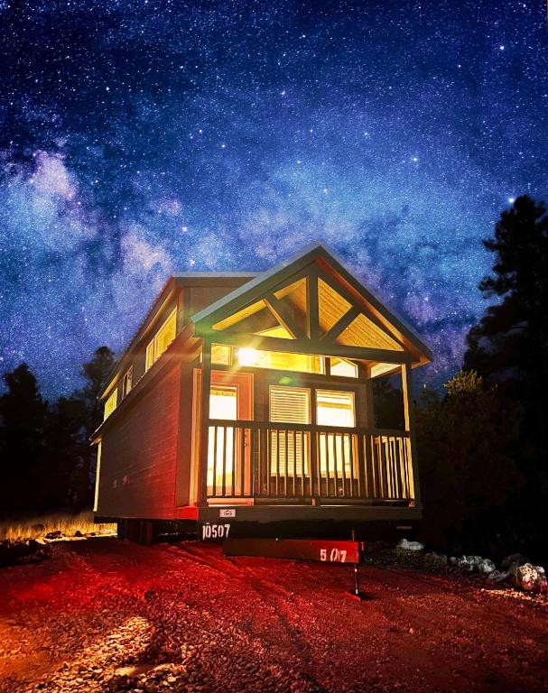 a tiny house at night with a starry sky at Cozy Cabin By Forest View 5B in Williams