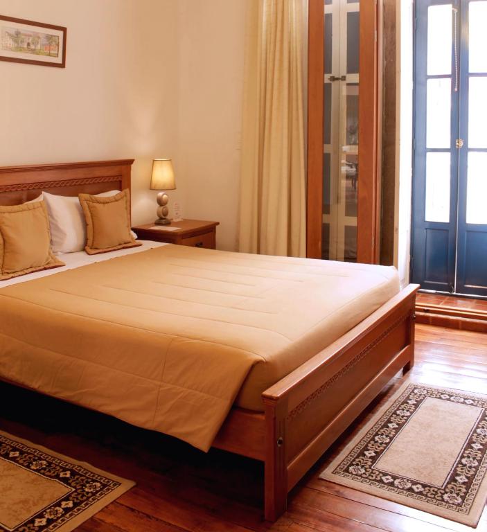 Postel nebo postele na pokoji v ubytování Casa Hotel Las Plazas