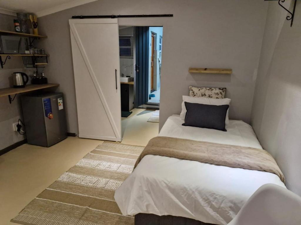 Postel nebo postele na pokoji v ubytování Toekoms Inn