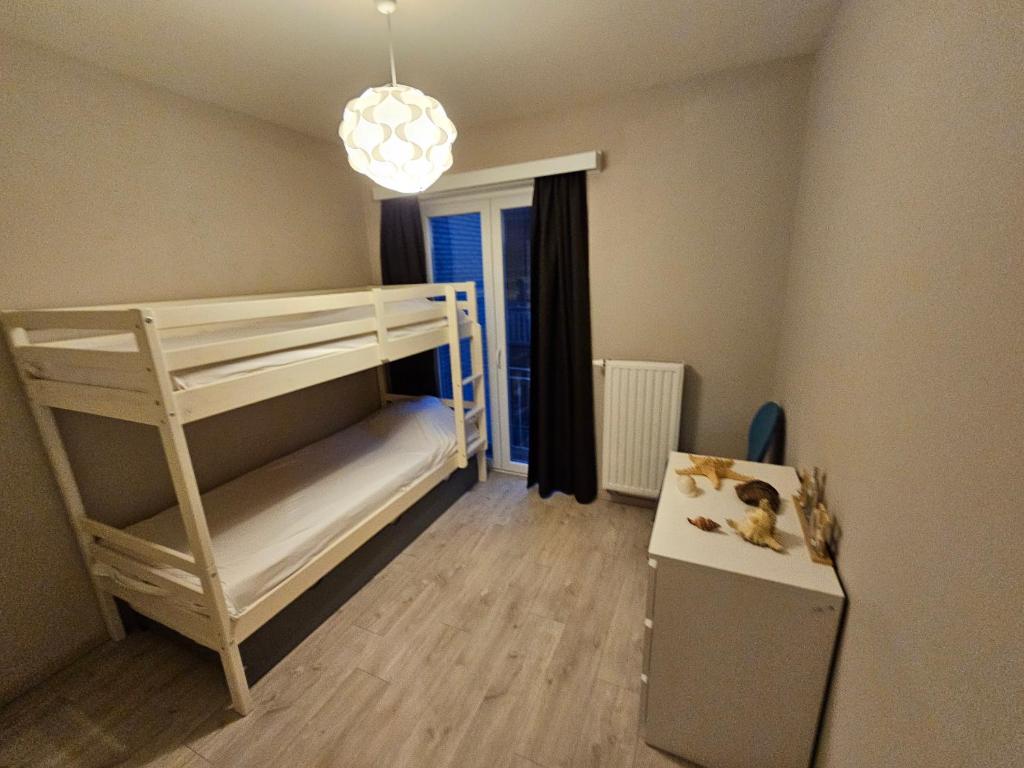 Postel nebo postele na pokoji v ubytování Côte à l'Oostduinkerke met gratis garage