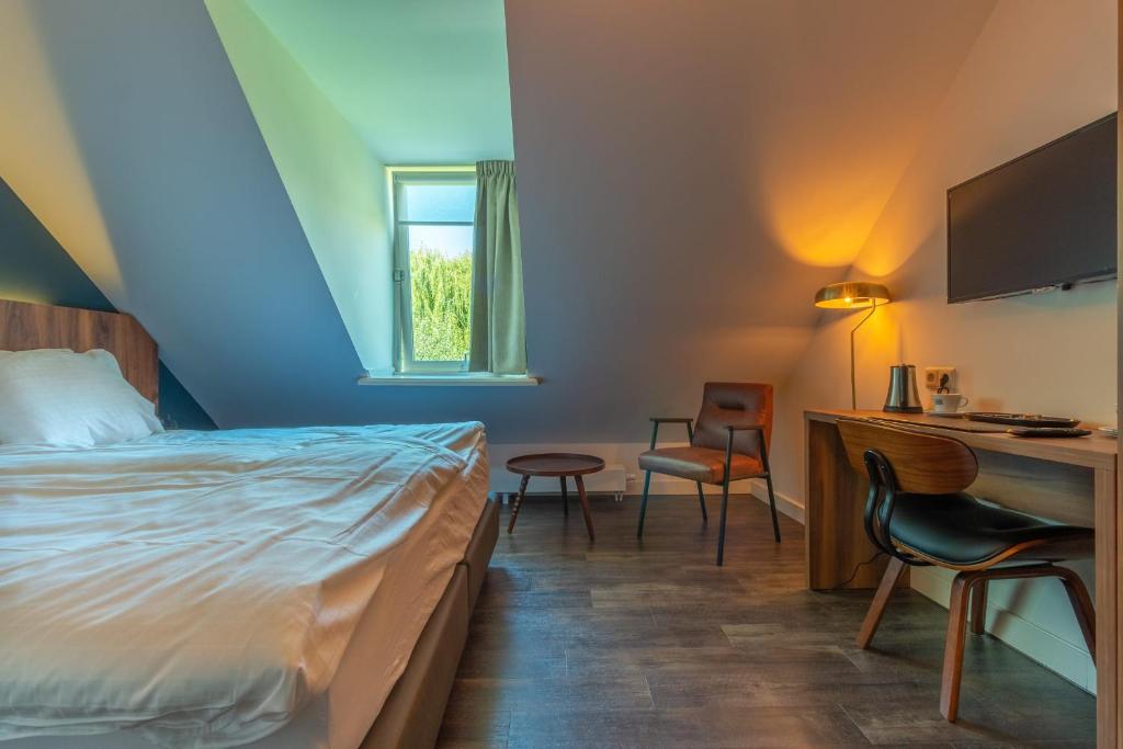Postel nebo postele na pokoji v ubytování Hotel Zutphen
