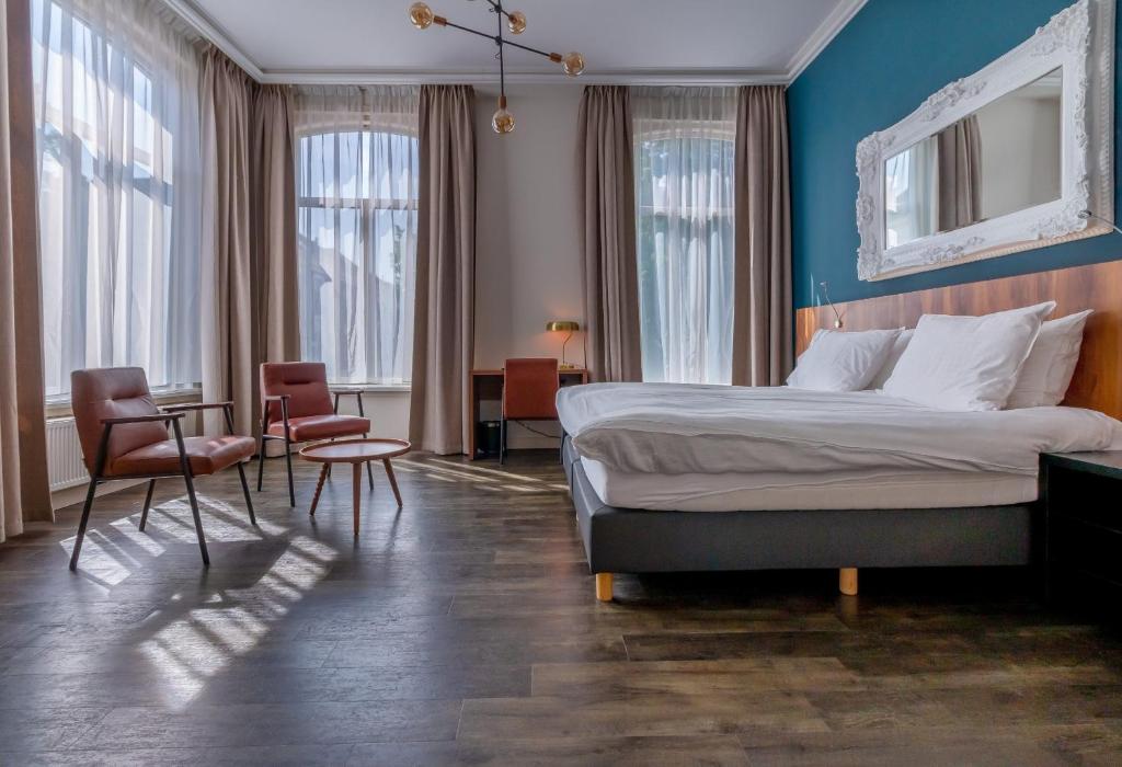 Postel nebo postele na pokoji v ubytování Hotel Zutphen
