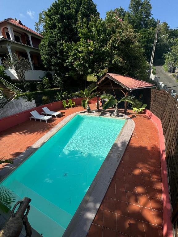 Bazén v ubytování La Canopée Enchantée, chambres d'hôtes, piscine, proche aéroport, Gare maritime nebo v jeho okolí