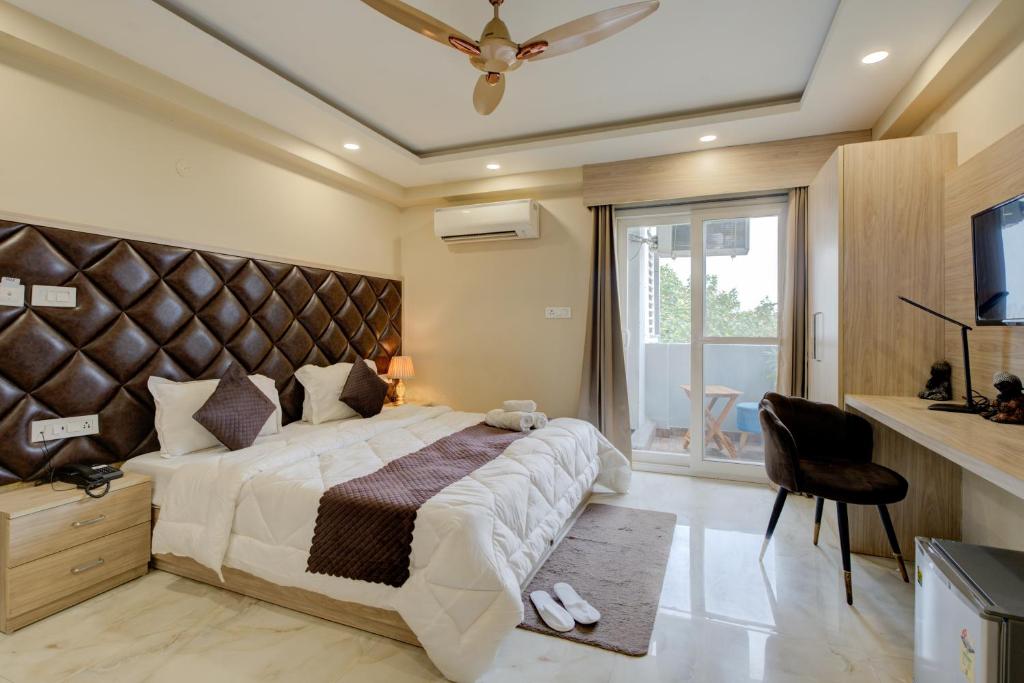 Postel nebo postele na pokoji v ubytování The Paras Studio Serviced Apartments