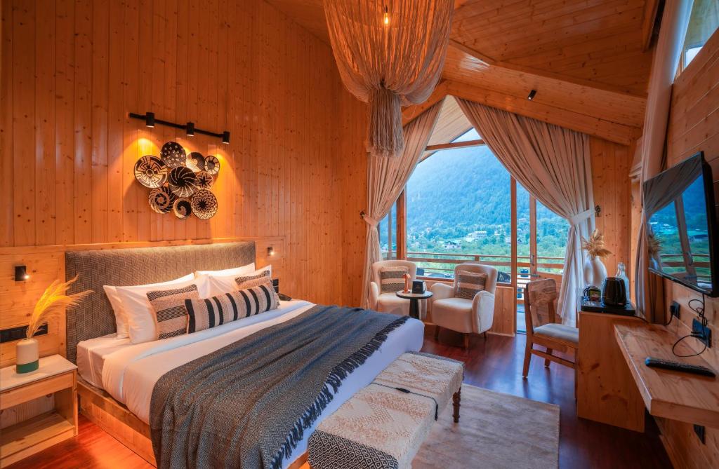 Postel nebo postele na pokoji v ubytování Olgah Manali