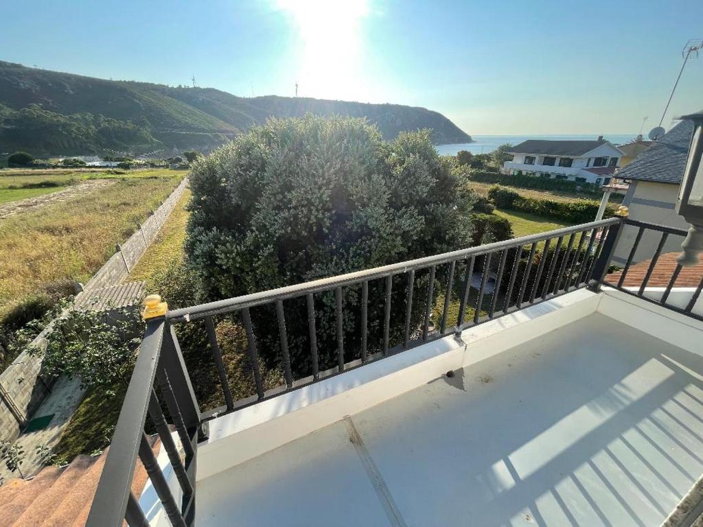 a balcony with a view of the ocean at Casa - Chalet en Barizo - Malpica de Bergantiños in A Coruña