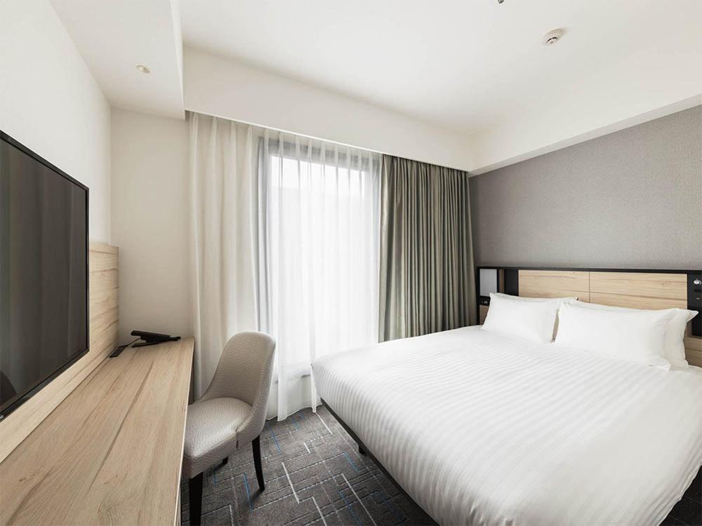 Postel nebo postele na pokoji v ubytování JR East Hotel Mets Premier Gotanda