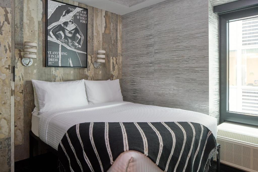 Postel nebo postele na pokoji v ubytování The FIDI Hotel