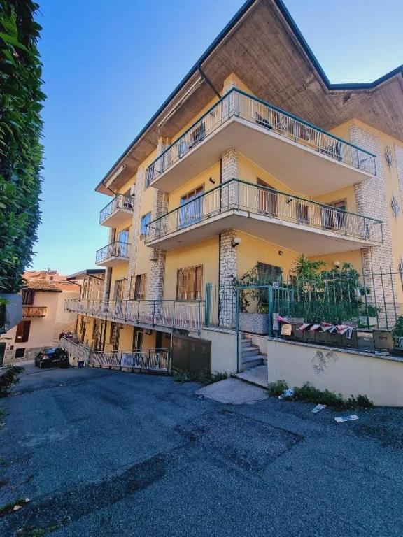 a large building with balconies on the side of it at Appartamento Capolaterra in Desenzano del Garda