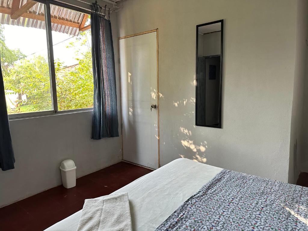 Postel nebo postele na pokoji v ubytování Otorongo Guest House
