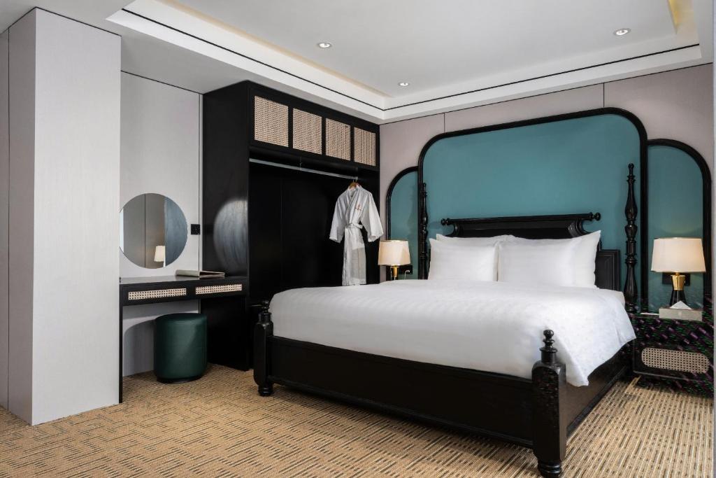 Postel nebo postele na pokoji v ubytování Hanoi International Hotel