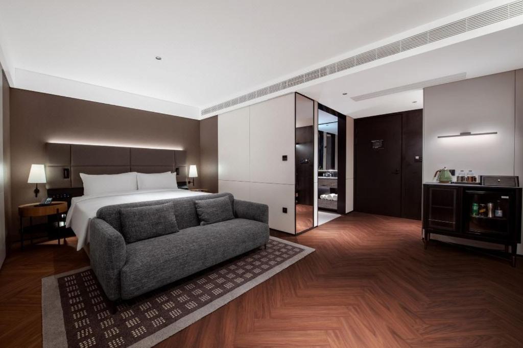 Postel nebo postele na pokoji v ubytování Intercity Hotel Shantou CHJ