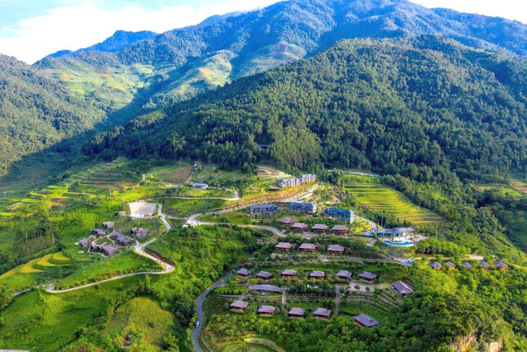 an aerial view of a resort in the mountains at Le Champ Tu Le in Poum Ban