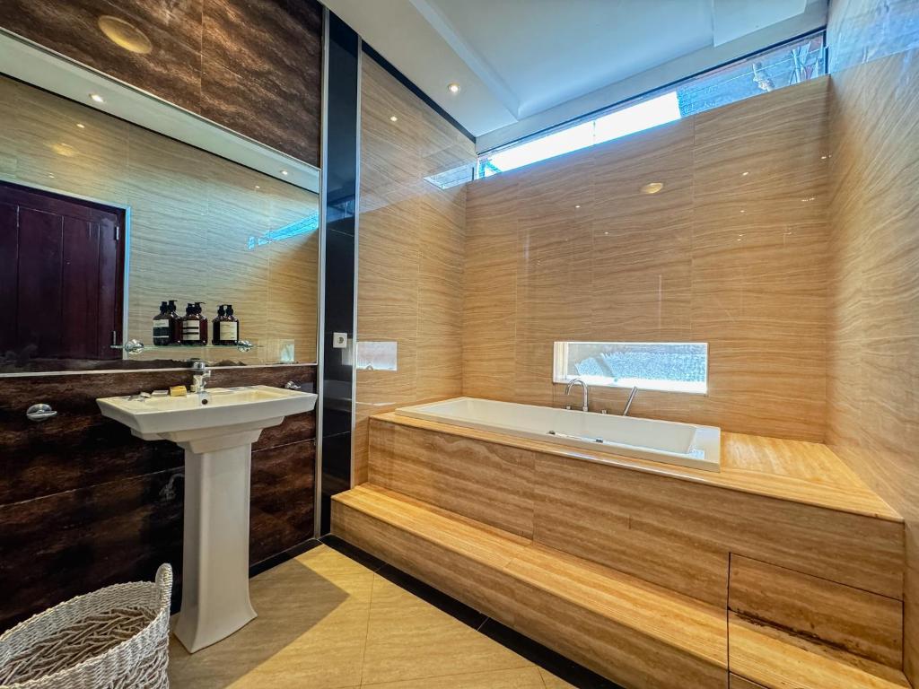 Koupelna v ubytování Merdeka Kuta Guesthouse
