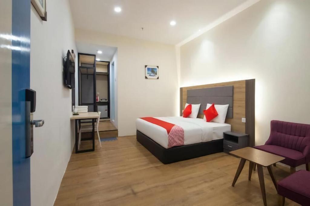 Postel nebo postele na pokoji v ubytování Agape Hotel Selayang
