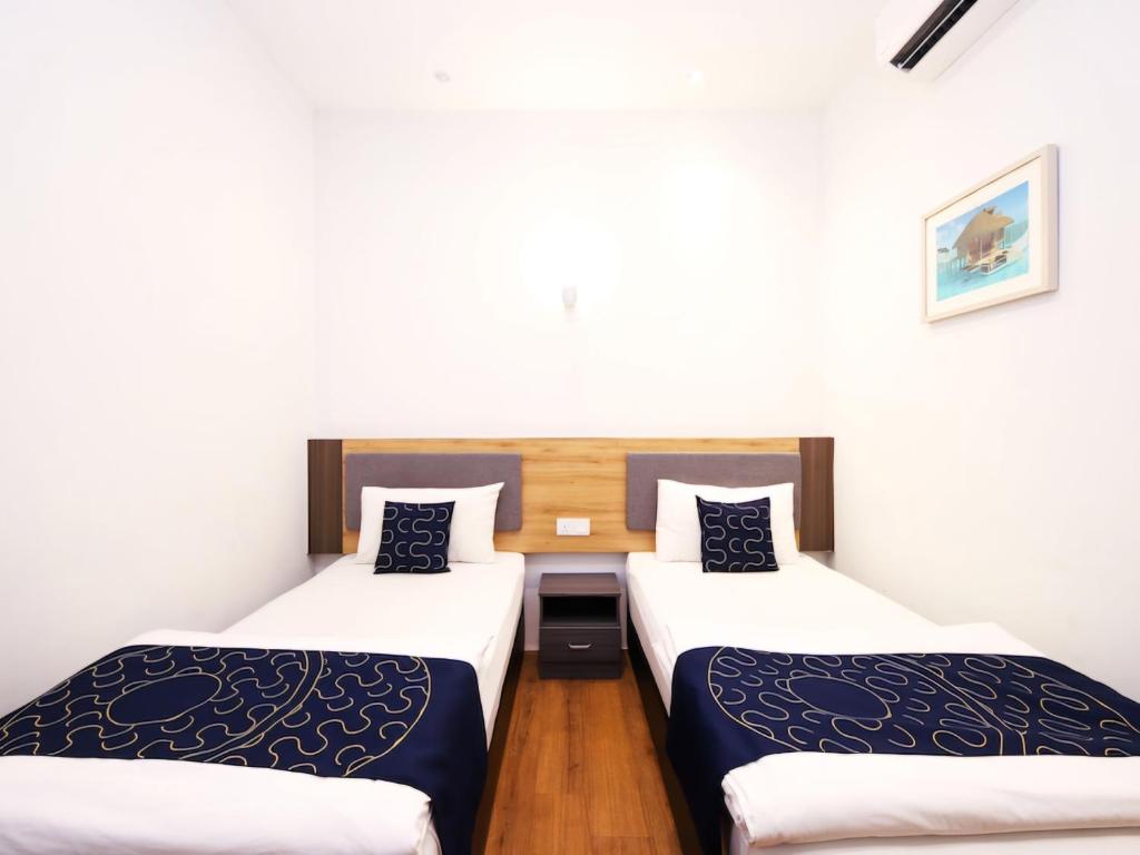 Postel nebo postele na pokoji v ubytování Agape Hotel Selayang