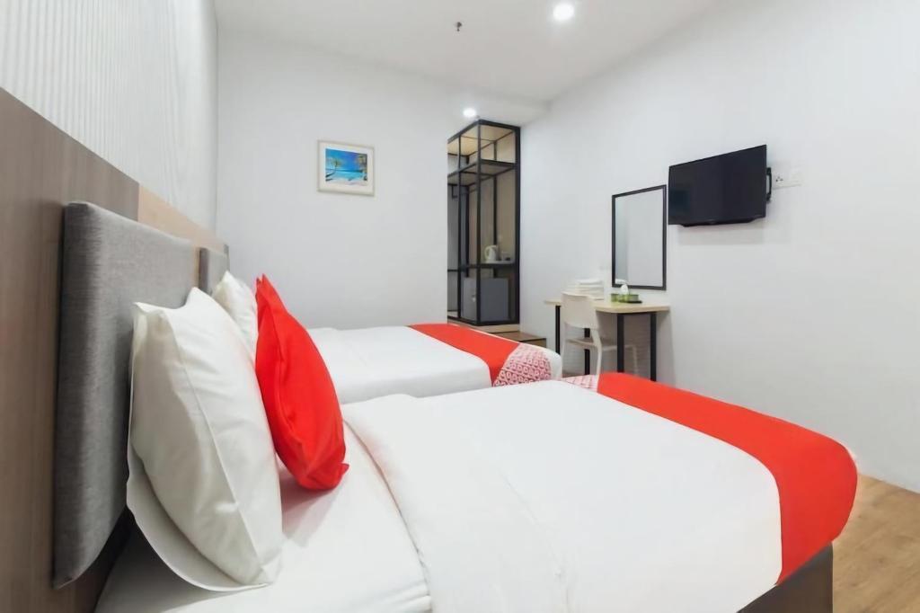 Postel nebo postele na pokoji v ubytování Agape Hotel Selayang