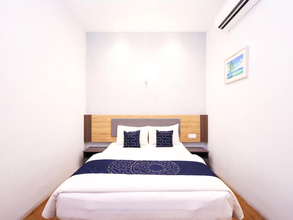 Postel nebo postele na pokoji v ubytování Agape Hotel Selayang