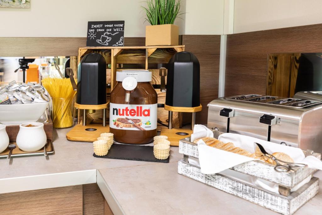 Kuchyň nebo kuchyňský kout v ubytování Hotel Aviva