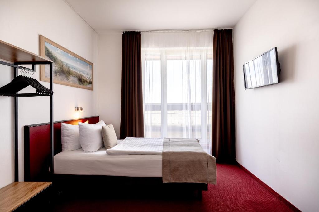 Postel nebo postele na pokoji v ubytování Hotel Aviva