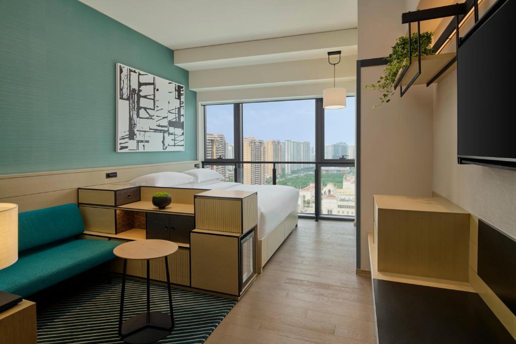 Postel nebo postele na pokoji v ubytování Artyzen Habitat Hengqin Zhuhai