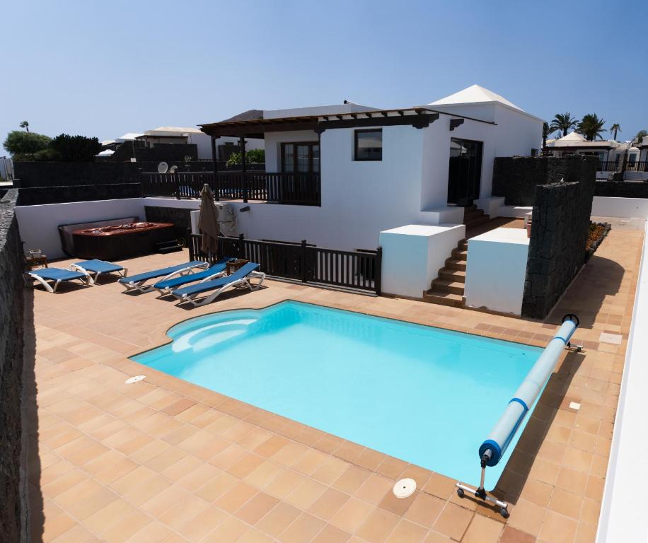 a swimming pool on the roof of a house at CASA PARI in Playa Blanca