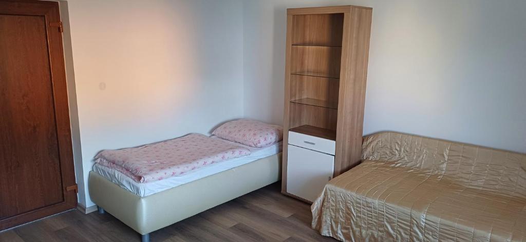 Postel nebo postele na pokoji v ubytování Apartmánový dům TERKA